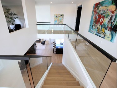 Glass panels in place of spindles add a modern and airy touch to the staircase. Julie Oliver/Postmedia