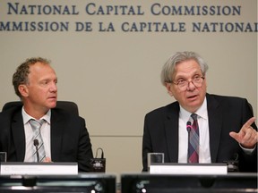 NCC CEO Mark Kristmanson (right) talks while chairman Marc Seaman looks on during Tuesday's NCC board meeting.