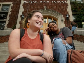 Grade 11 students Charlotte Dwyer (left) and Ny Holmes sit outside Nepean High School on Tuesday.