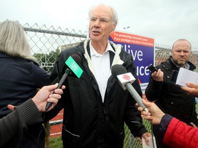 Mayoral candidate and former city councillor Clive Doucet talks at his news conference in front of the field at Immaculata High School on Thursday, Sept. 20, 2018.