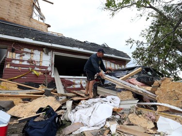Brian Lowden walks through the rubbles of his home on Thomas Dolan Parkway in Dunrobin, September 23, 2018. A tornado left parts of Ottawa and Gatineau devastated.   Photo by Jean Levac/Postmedia   130048