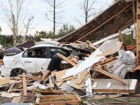 Brian Lowden combs through the wreckage of his home on Thomas Dolan Parkway in Dunrobin, September 23, 2018.