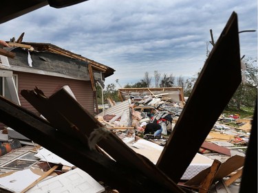 Nicole Lowden combs through the wreckage of her home on Thomas Dolan Parkway in Dunrobin, September 23, 2018. A tornado left parts of Ottawa and Gatineau devastated.   Photo by Jean Levac/Postmedia   130048