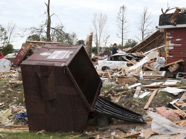 Brian Lowden combs through the wreckage of her home on Thomas Dolan Parkway in Dunrobin, September 23, 2018. A tornado left parts of Ottawa and Gatineau devastated.   Photo by Jean Levac/Postmedia   130048