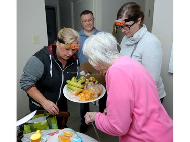 The pair give out muffins and fruit on Monday morning at a Nepean seniors' residence still without power.