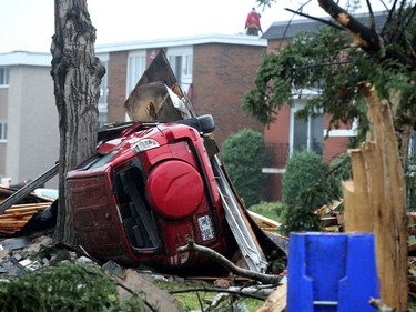 - the Ben-Salem family car sits upended against a tree, flung from the parking lot in the tornado. Demolition started in the Mont-Bleu area of Gatineau Tuesday following the tornado that ripped through the housing development Friday. People could be found gathering up what little they could find in the remains of their homes as crews worked to demolish unsafe buildings and clean up debris.  Julie Oliver/Postmedia
