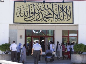 People arrive for Friday prayer at the Assalam Mosque at The Ottawa Islamic Centre.