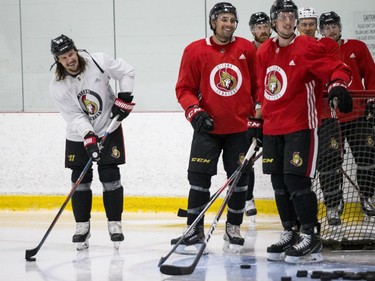 Ottawa Senators captain Erik Karlsson (L) and teammates  during an informal pre-training camp skate at the Bell Sensplex. September 11, 2018. Errol McGihon/Postmedia