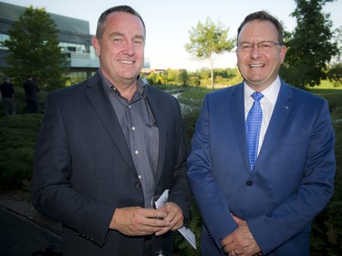 Tom Lang, Mitel's vice-president, and Yves Laberge, general manager of Star Motors.