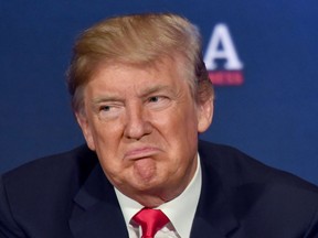 Donald Trump listens to a question during a roundtable discussion on the new tax law at the Cleveland Public Auditorium and Conference Center on May 5, 2018, in Cleveland, Ohio.