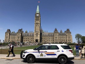 File photo of an RCMP cruiser parked in front of Parliament Hill.