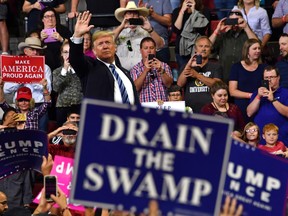 Donald Trump waves to the crowd during a "Make America Great Again" rally in Billings, Montana on September 6, 2018.