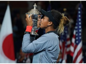 US Open Women's Single champion Naomi Osaka of Japan kisses the trophy following her Women's Singles Finals match against Serena Williams of the US at the 2018 US Open.