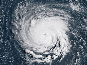 This NOAA/RAMMB satellite image taken at 11:45:31 UTC on September 10, 2018, shows Hurricane Florence off the US east coast in the Atlantic Ocean.