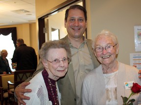 Alan Clausi, co-owner of City View Retirement Community, with two of the community’s happy residents.