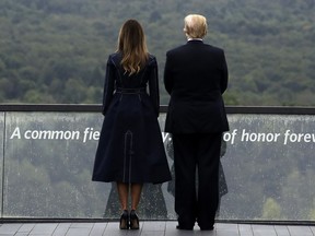 President Donald Trump and first lady Melania Trump, stand along the September 11th Flight 93 Memorial, Tuesday, Sept. 11, 2018, in Shanksville, Pa.