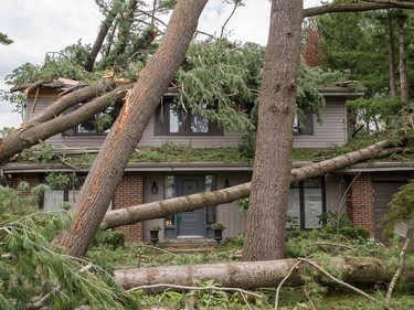 The home at 49 Parkland is severely damaged as seen on Sunday morning as residents in Ottawa's Arlington Woods neighbourhood deal with the aftermath of the twister.