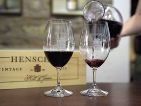 Glasses of Henschke Cellars Pty Hill of Grace 2012 Shiraz red wine are poured at the winemaker's Cellar Door and Winery in Eden Valley, South Australia, Australia, on Tuesday, April 3, 2018.
