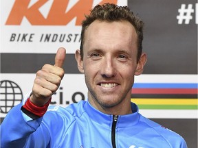 Third place winner Michael Woods from Canada gives a thumbs up after the men's road race at the Road Cycling World Championships in Innsbruck, Austria, Sunday, Sept.30, 2018.