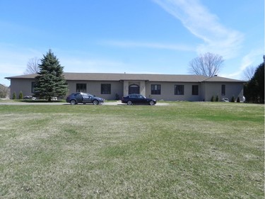 Before: The previous exterior of this Manotick bungalow was described as dull, non-descript and institutional.