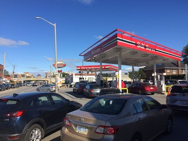 Drummond's on Bank Street. Cars lined up to get gas.