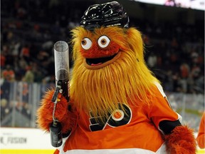 The Philadelphia Flyers mascot, Gritty, takes to the ice during the first intermission of the Flyers' preseason NHL hockey game against the Boston Bruins, Monday, Sept, 24, 2018, in Philadelphia.