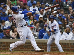 The Cubs' Willson Contreras hits a two-run homer during the fifth inning of Sunday's game the Cardinals.