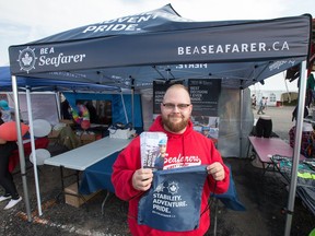 Anthony Côté at his Seafarers union booth at the Carp Fair on Friday. Wayne Cuddington/Postmedia