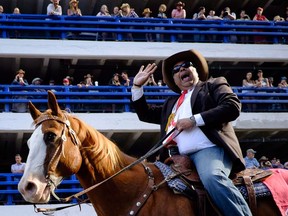 Calgary Mayor Naheed Nenshi says he will ask the city's integrity commissioner to investigate a leak of details from an in-camera council meeting surrounding costs connected to the potential hosting of the 2026 Winter Olympic and Paralympic Games. Calgary Mayor Naheed Nenshi rides a horse during the Calgary Stampede parade in Calgary, Friday, July 7, 2017.