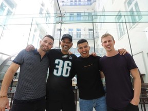 Members of YouTube channel "Yes Theory", from left to right, Matt Dajer, Ammar Kandil and Thomas Brag pose for a photo with actor Will Smith in an undated handout photo.