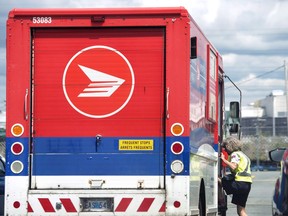 The Crown corporation and the Canadian Union of Postal Workers have extended contract negotiations beyond an early Wednesday deadline for a strike or lockout, providing some hope that new deals can be struck without a service disruption. A Canada Post employee climbs into a mail truck in Halifax on Wednesday, July 6, 2016.