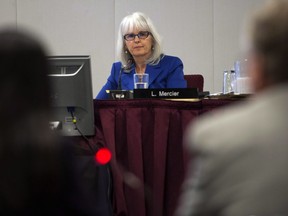 Lyne Mercier listens to presentations at the National Energy Board hearings into the Enbridge Pipelines proposals Thursday, October 10, 2013 in Montreal. The National Energy Board has named the panel that will conduct its reconsideration of the Trans Mountain expansion project. The board has assigned Lyne Mercier, Alison Scott and Murray Lytle to the panel.THE CANADIAN PRESS/Ryan Remiorz