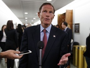 Sen. Richard Blumenthal, D-Conn., speaks to media during a break in a Senate Judiciary Committee hearing on Capitol Hill in Washington, Thursday, Sept. 27, 2018, with Christine Blasey Ford and Supreme Court nominee Brett Kavanaugh.