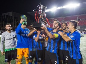 The Montreal Impact hoist the trophy after a win over the Ottawa Fury in the inaugural CapCity Cup at TD Place Stadium on Friday, Sept. 07, 2018.