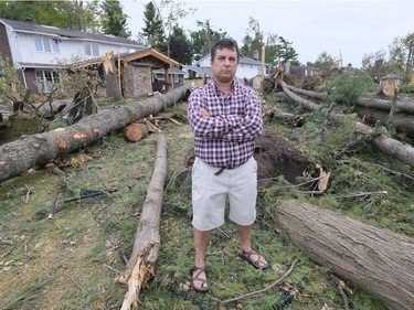 Arlington Woods resident James O'Grady with some of the dramatic tornado damage in his community. September 27,2018.