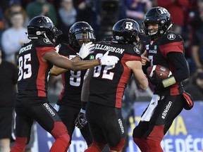 Ottawa Redblacks wide receiver Greg Ellingson (82) is surrounded by teammates wide receiver Diontae Spencer (85), wide receiver R.J. Harris (84), and quarterback Trevor Harris (7) after scoring a touchdown against the Edmonton Eskimos during the second half on Saturday, Sept. 22, 2018.