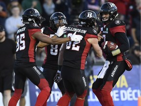 Ottawa Redblacks wide receiver Greg Ellingson (82) is surrounded by teammates wide receiver Diontae Spencer (85), wide receiver R.J. Harris (84), and quarterback Trevor Harris (7) after scoring a touchdown against the Edmonton Eskimos during second half CFL football action in Ottawa on Saturday, Sept. 22, 2018.