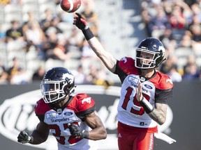 Calgary Stampeders quarterback Bo Levi Mitchell (19) throws during the first half against the Hamilton Tiger-Cats on Saturday, Sept. 15, 2018.