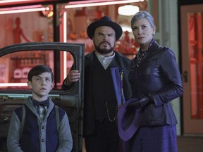 This image released by Universal Pictures shows Owen Vaccaro, from left, Jack Black and Cate Blanchett in a scene from "The House With A Clock in Its Walls."