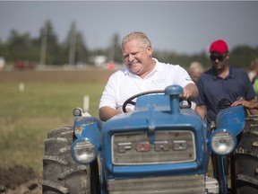 Ontario Premier Doug Ford takes part in the 2018 International Plowing Match and Rural Expo near Chatham this past week. His announced cuts to ODSP increases are hurting some Ontarians.