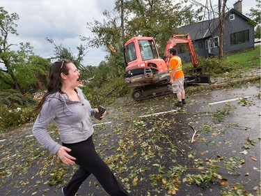 A longtime resident of the area, Christy Jarvis reacts as she sees the devastation in Dunrobin as a reported tornado touched down in Dunrobin in the far west end of Ottawa. Wayne Cuddington/ Postmedia