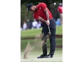 Tiger Woods hits from the third fairway during the final round of the Tour Championship golf tournament Sunday, Sept. 23, 2018, in Atlanta.