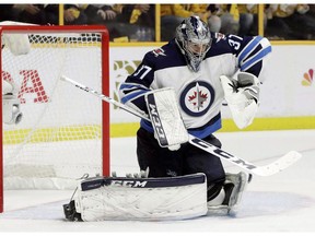 Winnipeg Jets goalie Connor Hellebuyck makes a stop against the Nashville Predators during the second period in Game 7 of an NHL hockey second-round playoff series in Nashville, Tenn., on May 10, 2018. The goalie for the Winnipeg Jets, like all NHL netminders, will be sporting a smaller chest protector this season as the league continues the process of shrinking equipment, following on the heels of recent size reductions for pads and pants.