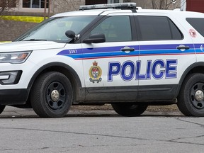 Police on the scene of the city's latest homocide, located at 11 Covington Place in the Centrepointe neighbourhood in the west end. Ottawa Police vehicle on scene of a homocide.  Photo by Wayne Cuddington/ Postmedia