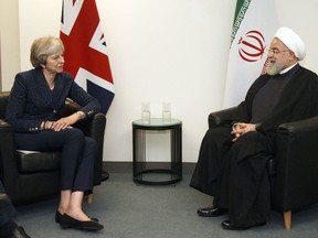 British Prime Minister Theresa May meets with Iranian President Hassan Rouhani on the sidelines of the 73rd session of the United Nations General Assembly at U.N. headquarters, Tuesday, Sept. 25, 2018.