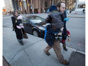 Joshua Boyle, his wife, Caitlan Boyle and their three children are seen walking up Elgin Street last October.