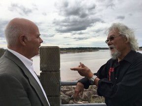 Environmentalist David Suzuki speaks with New Brunswick Green leader David Coon while overlooking the Petitcodiac River in Moncton, N.B., Friday, Sept.21, 2018.THE CANADIAN PRESS/Kevin Bissett