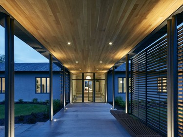 A wooden bench was added as part of the entry sequence Christopher Simmonds Architect created. It is meant to be a place for people to take a moment to relax or ponder.