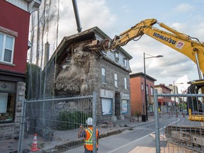 After the initial collapse, heavy machinery was brought in to bring down the southwest corner of the Magee House.