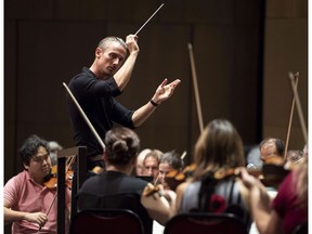 Music Director of the National Arts Centre Orchestra Alexander Shelley conducts the NAC Orchestra during the unveiling of upgrades to the NAC's Southam Hall, including a new orchestra shell for the performance venue, in Ottawa on Thursday, Sept. 6, 2018 in Ottawa.